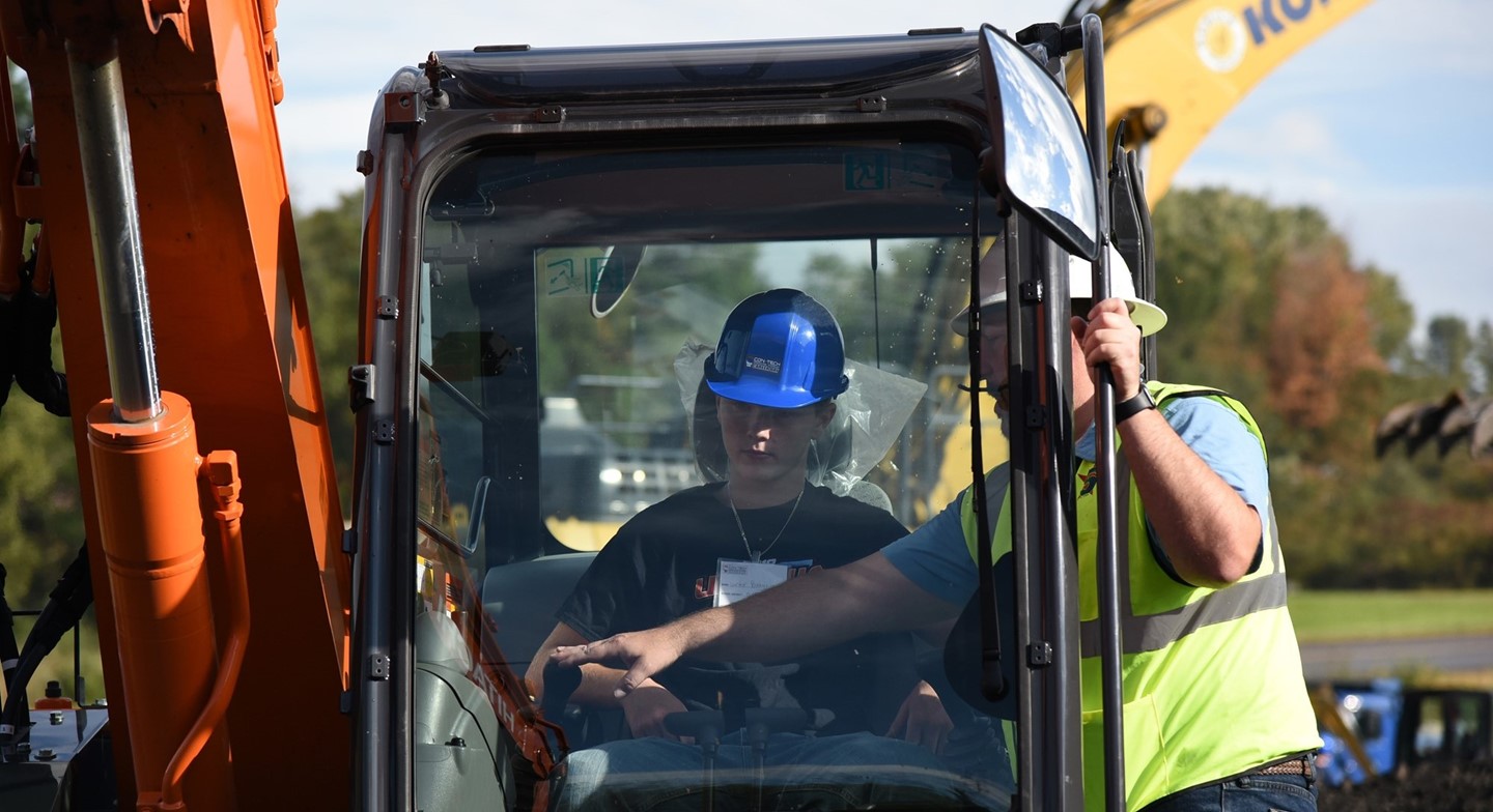 Student driving tractor at ConTech day