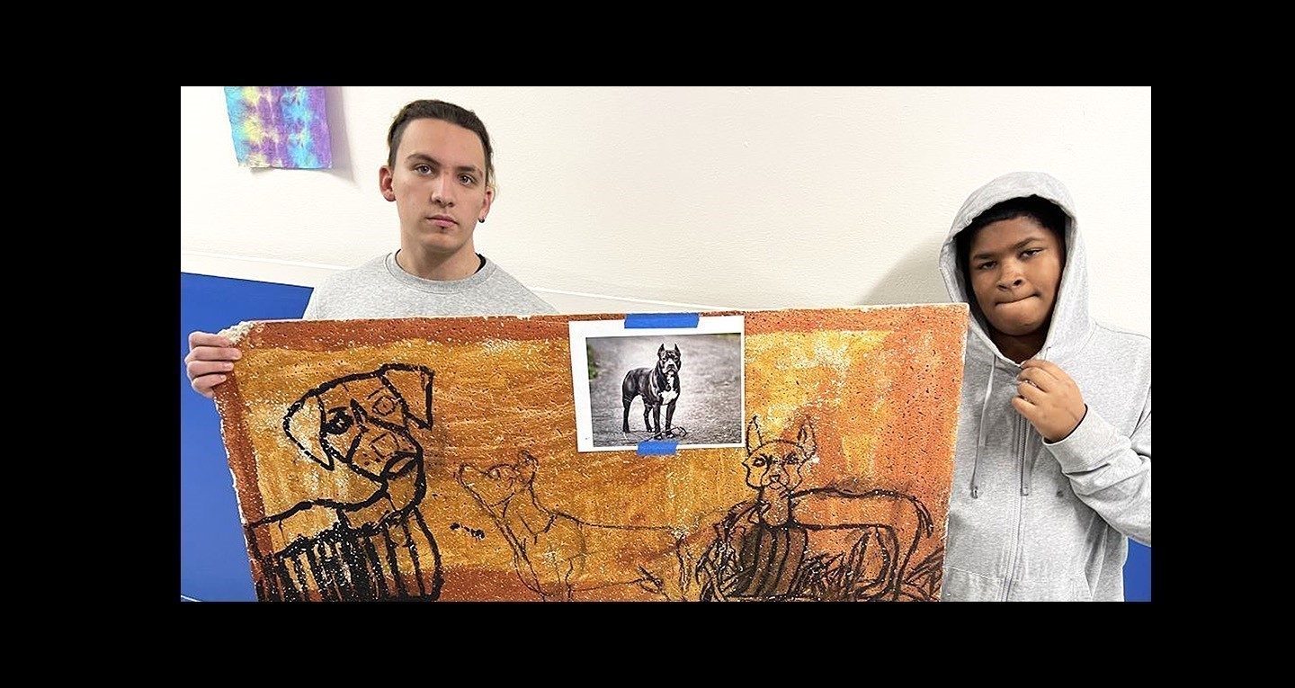 ELC students holding artwork