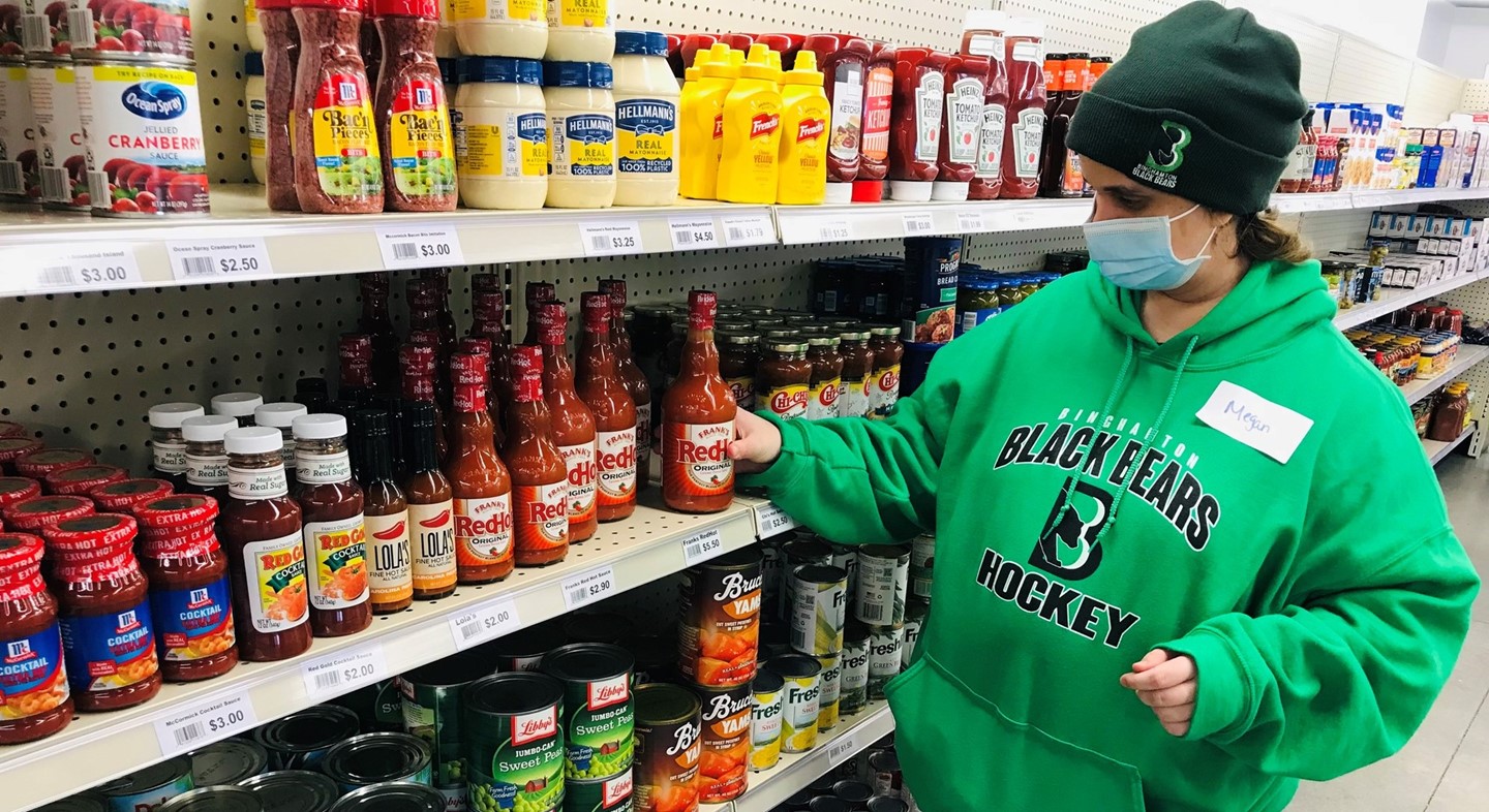 Student stocking shelves