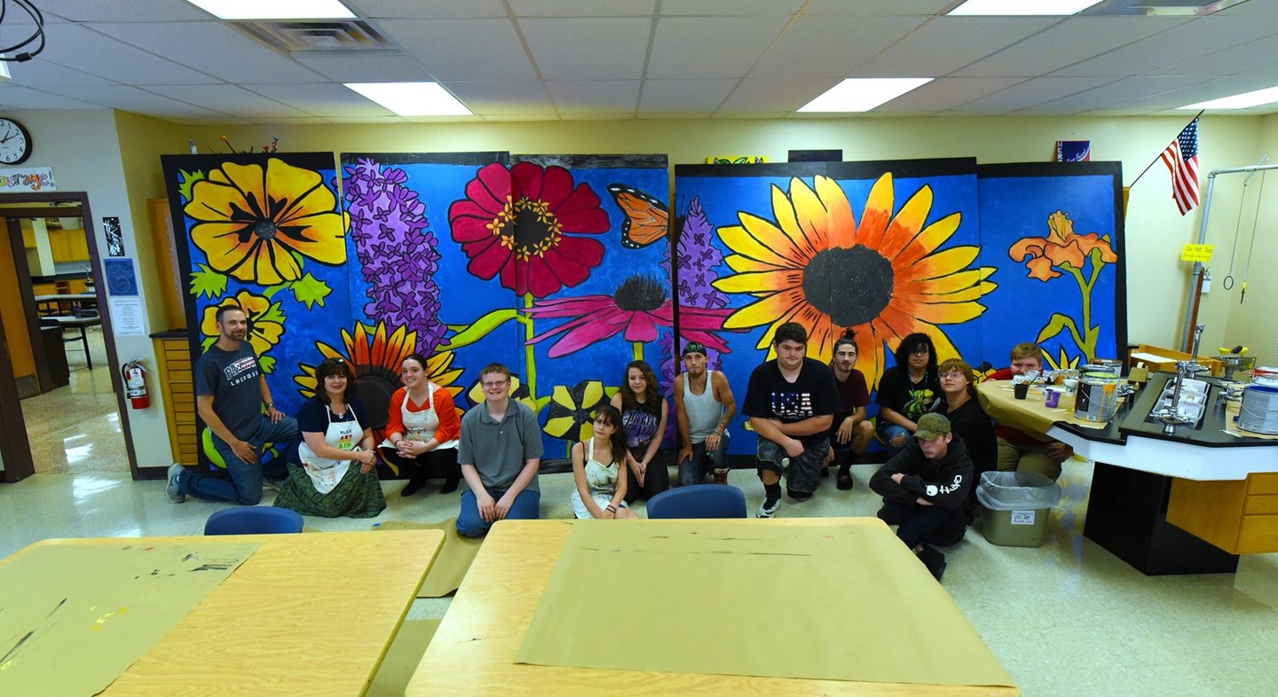 Students in front of mural