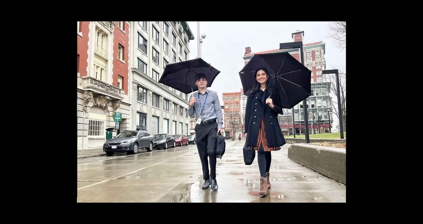 Students downtown Binghamton with Rain Gear