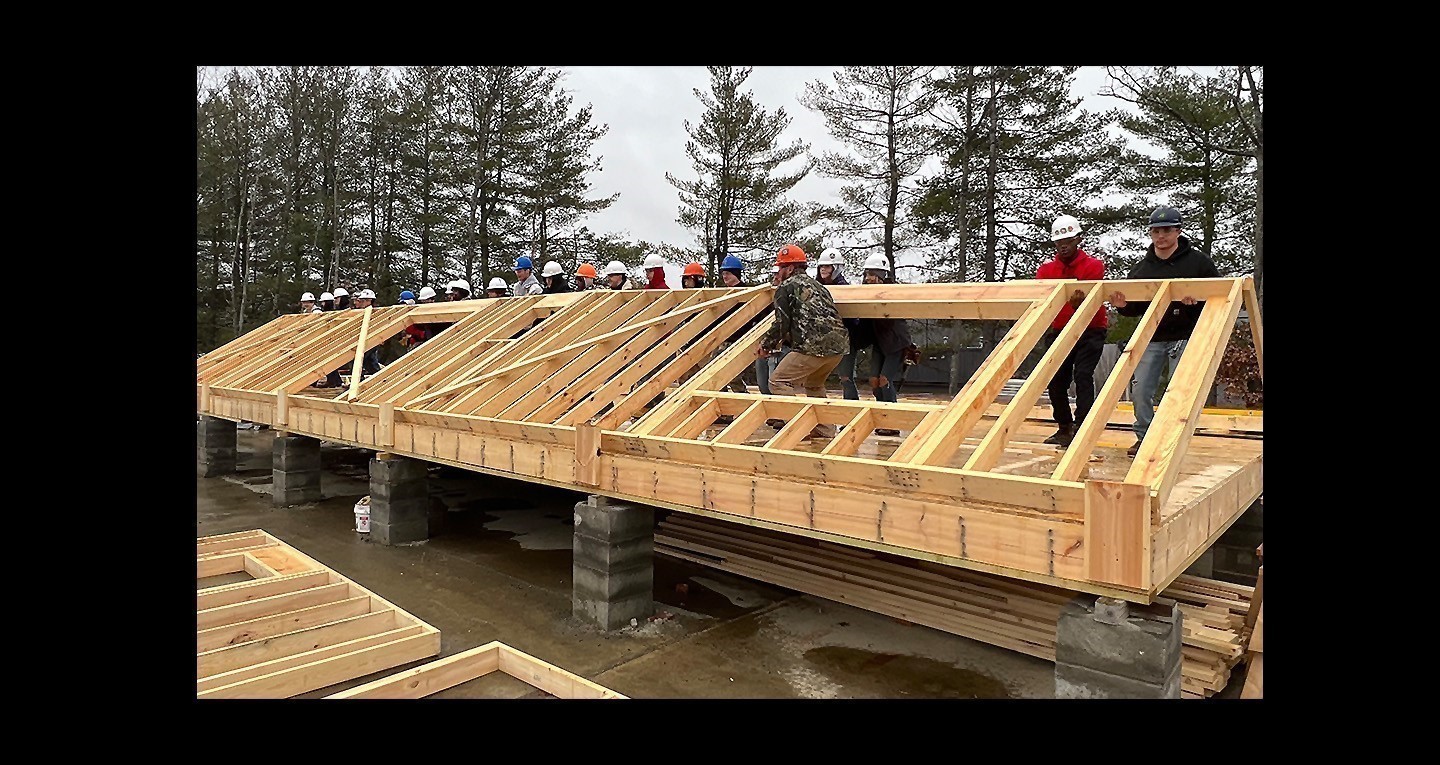 BOCES students raising wall on house