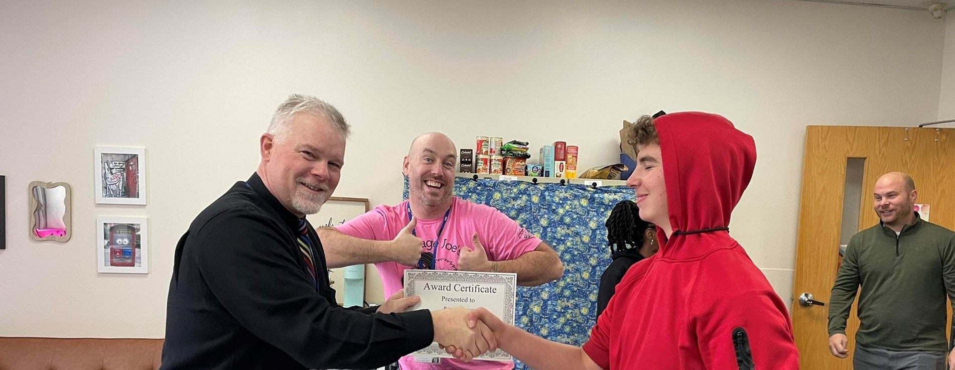 ELC Award handshake