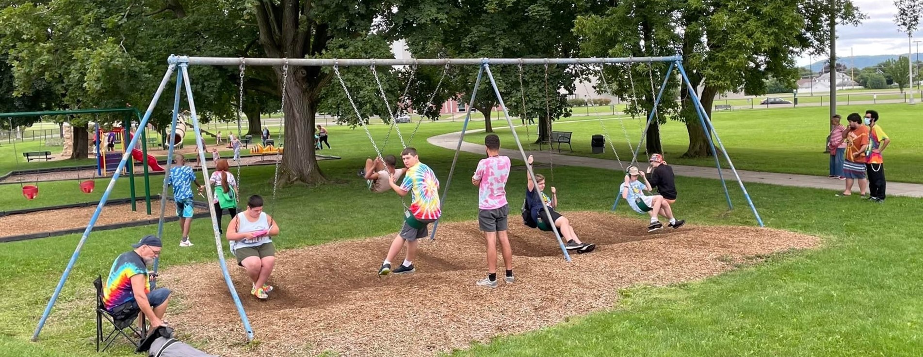 Oak Tree students swinging on swings